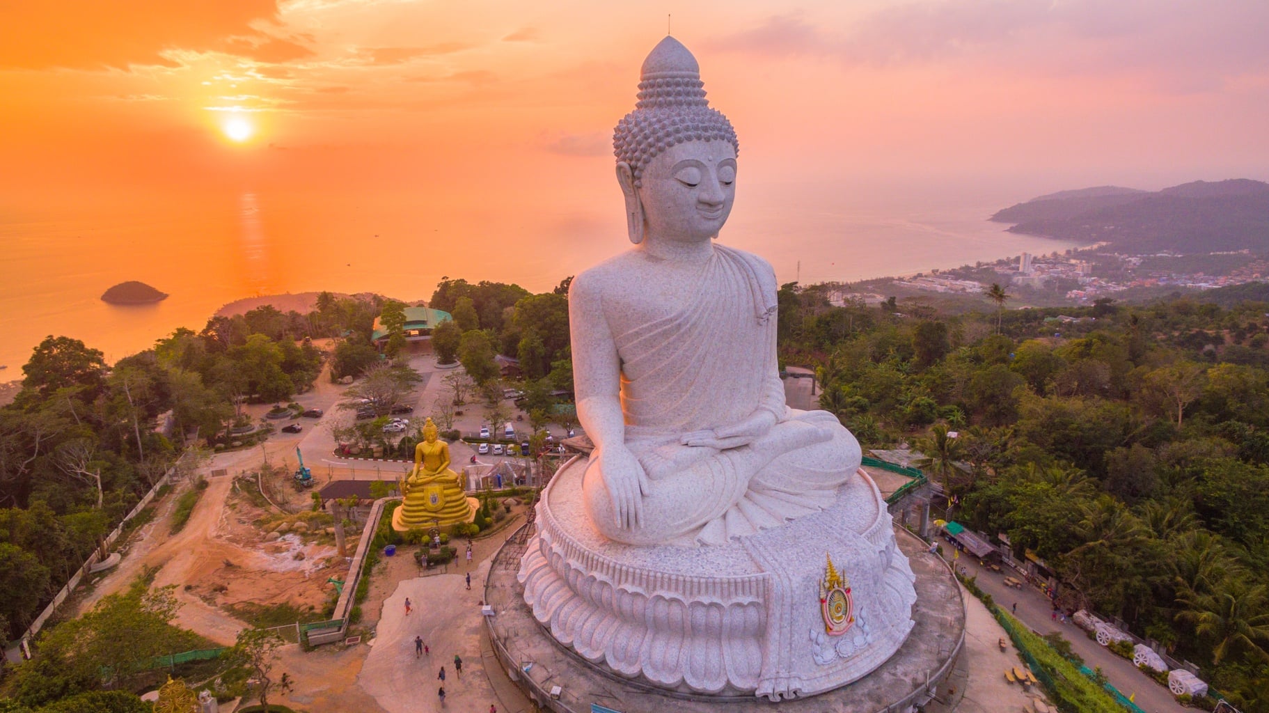 Phuket's white Big Buddha overlooking the coast at sunset