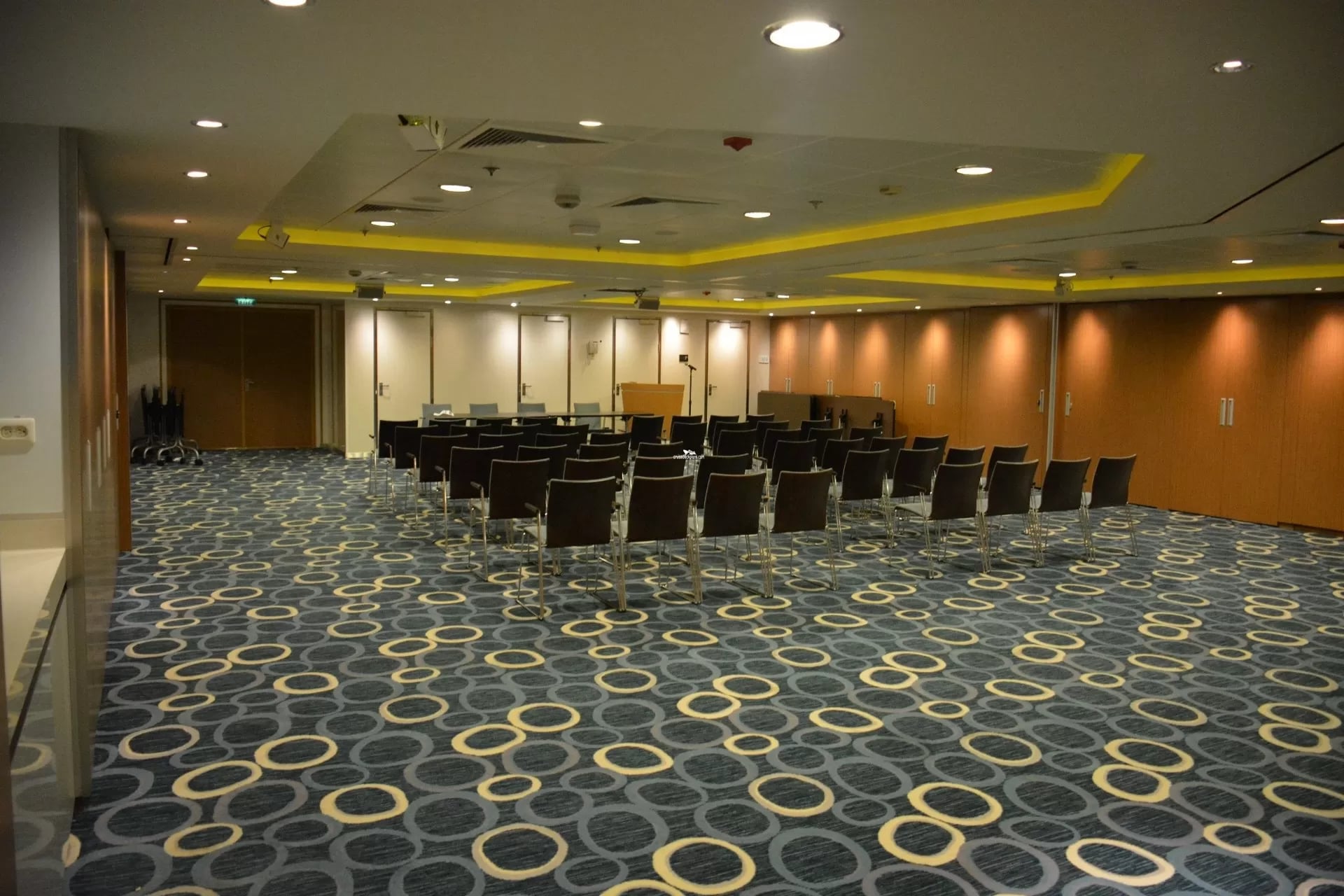 Conference Center main meeting room with rows of chairs and a podium