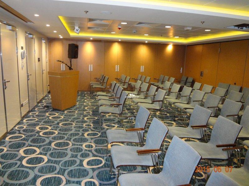 Smaller Conference Center meeting room with chairs and a lectern